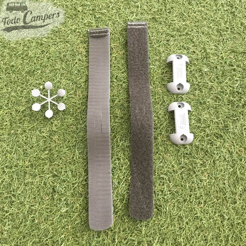 Fijación con tiras de velcro para recoger y guardar el Fiamma Tube Pro a la pared.