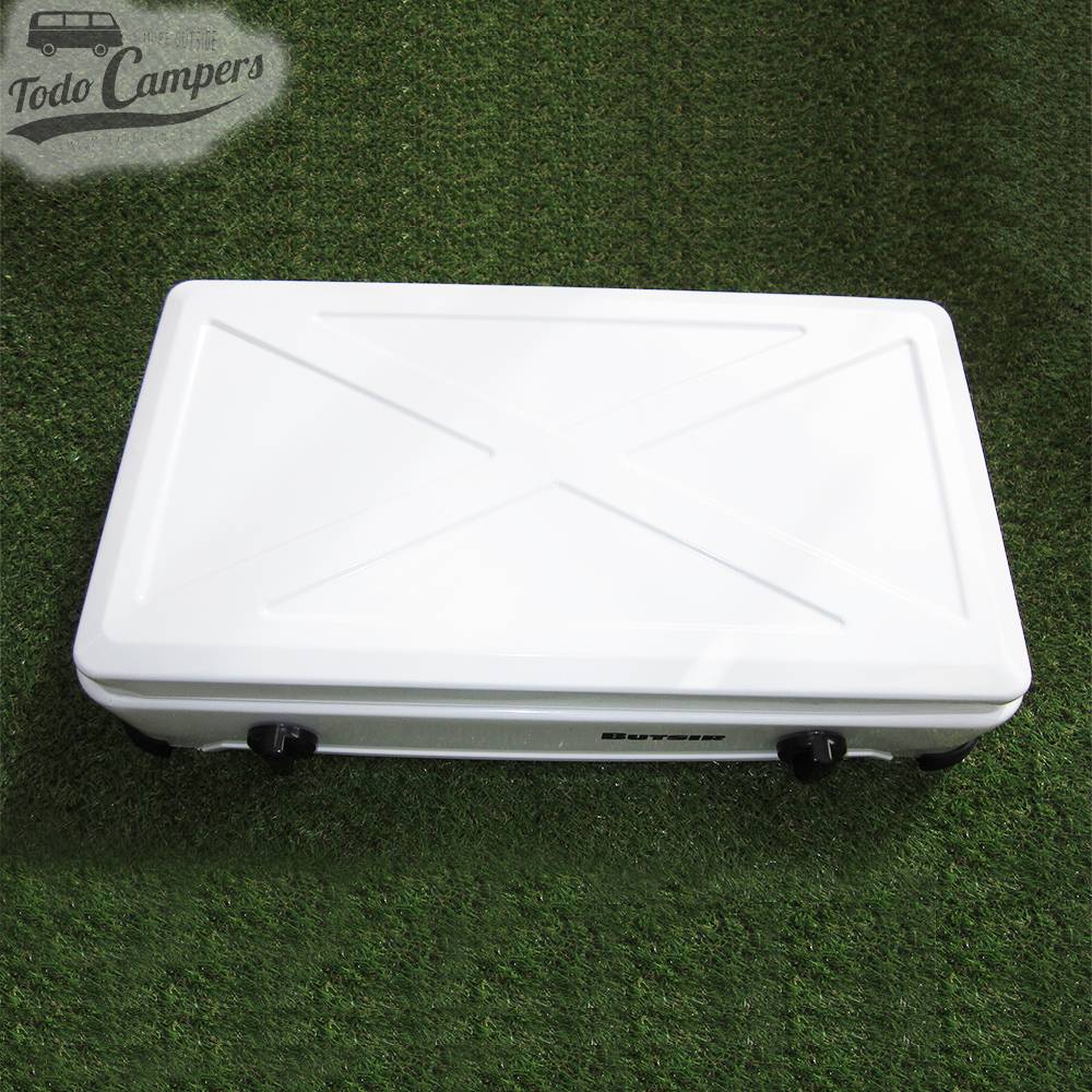 Cocina esmaltada con tapa de color blanco con dos quemadores tapada. Para tu furgoneta camper, autocaravana o caravana